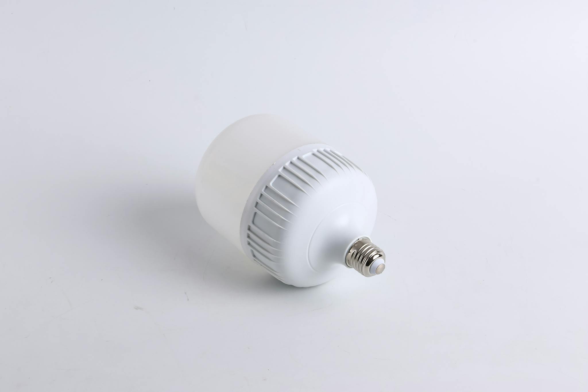 Close-up of a single LED light bulb on a plain white background, showcasing its design.